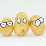 3 yellow potatoes on white surface for skin whitening