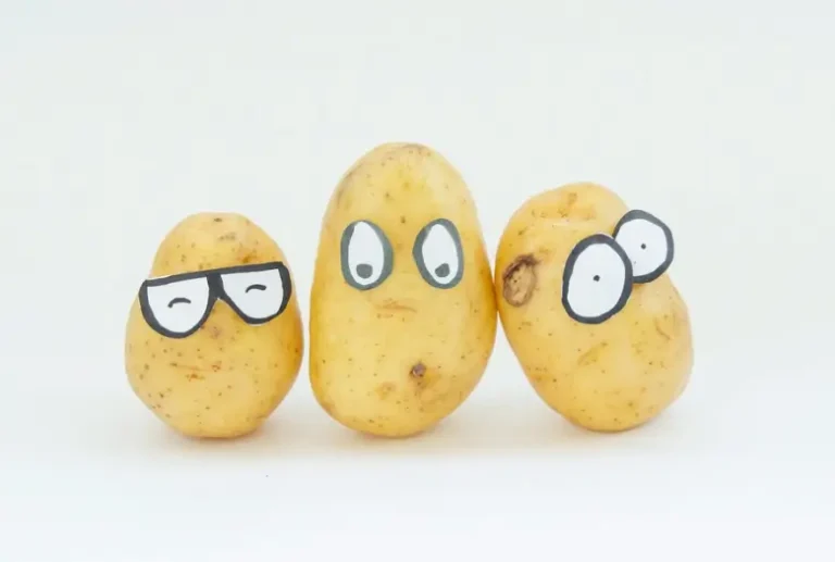 3 yellow potatoes on white surface for skin whitening